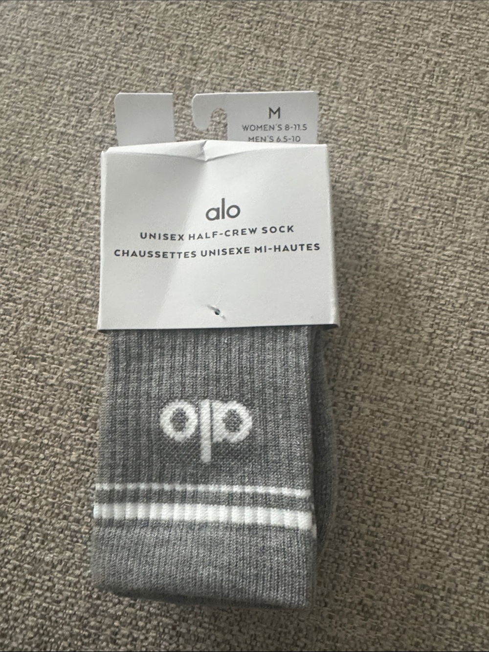ALO Yoga Unisex Half-Crew Socks in Light Gray with White Logo